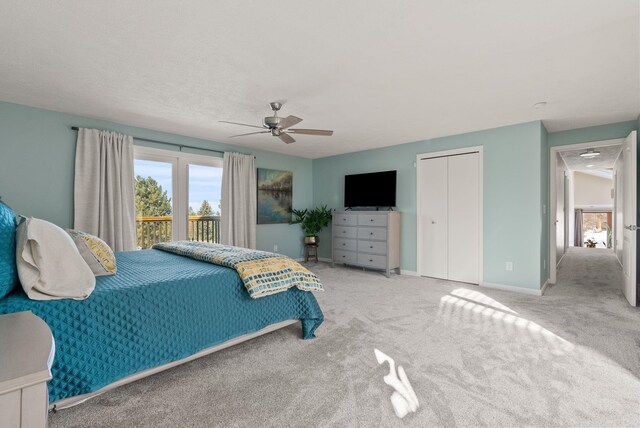 bedroom featuring light carpet, a closet, and ceiling fan