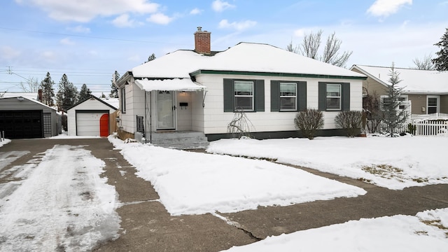 bungalow-style house with an outbuilding and a garage