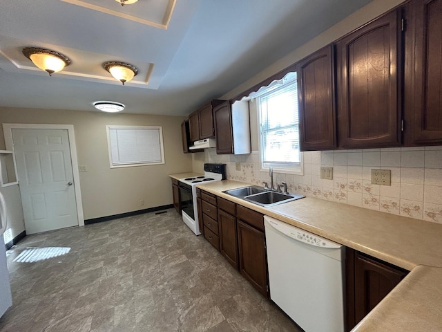 907 W Fairview Ave, Spokane, WA 99205 - kitchen featuring white appliances, a sink, under cabinet range hood, and decorative backsplash