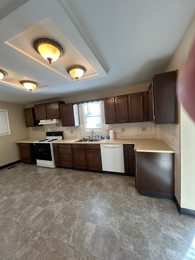 kitchen featuring a sink, electric range oven, light countertops, under cabinet range hood, and dishwasher