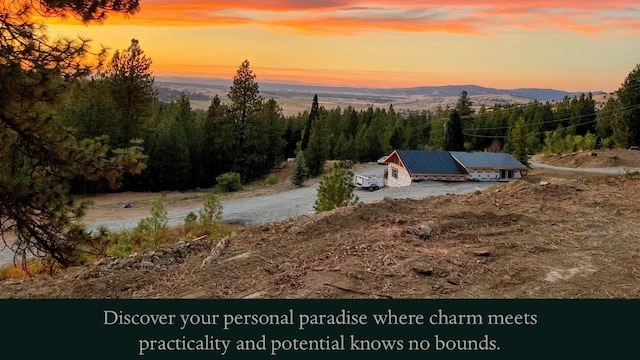 entry to storm shelter with a mountain view