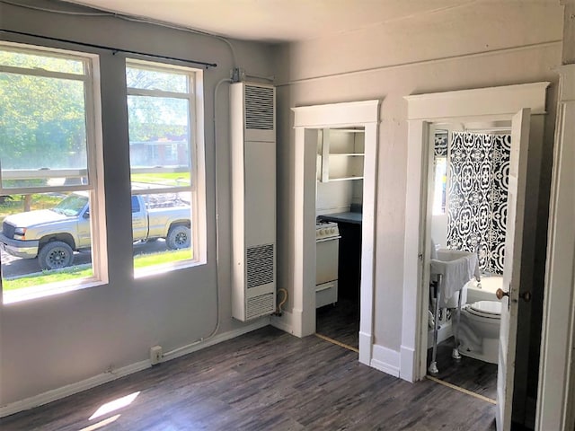 bedroom with dark hardwood / wood-style flooring