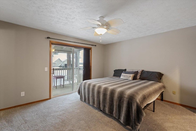carpeted bedroom featuring baseboards, access to outside, and a textured ceiling