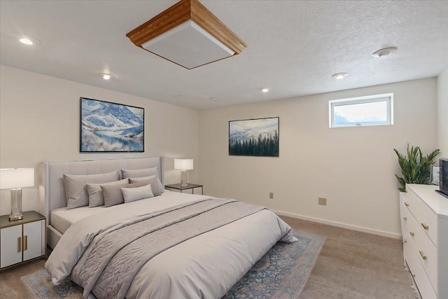 bedroom featuring recessed lighting, baseboards, and light carpet