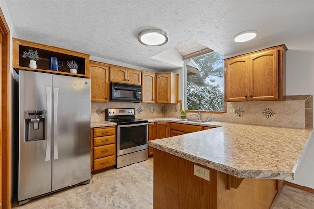kitchen featuring open shelves, a sink, stainless steel appliances, light countertops, and a peninsula