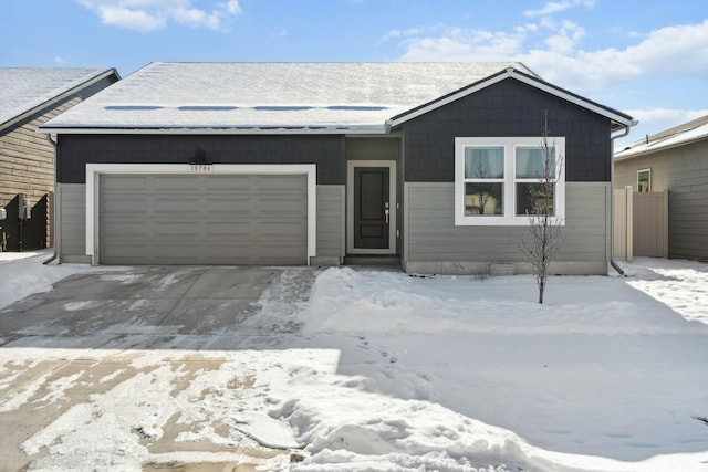 ranch-style home with a garage