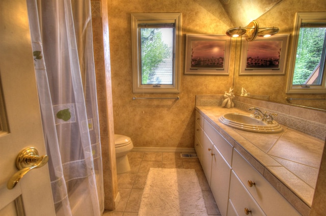 bathroom featuring vanity, tile patterned flooring, a shower with curtain, and toilet