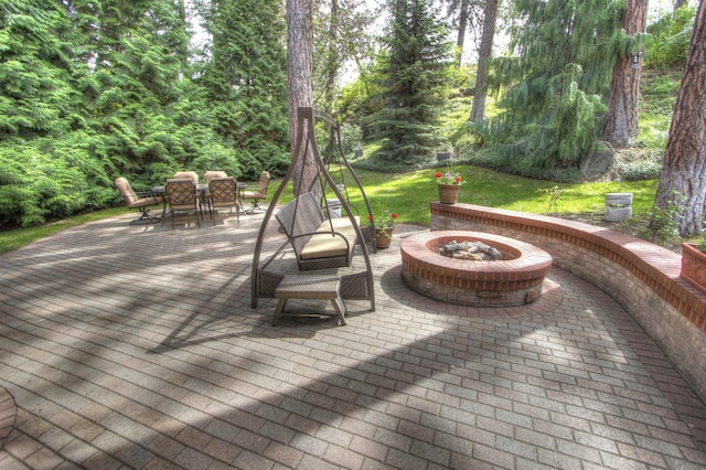 view of patio / terrace featuring a fire pit