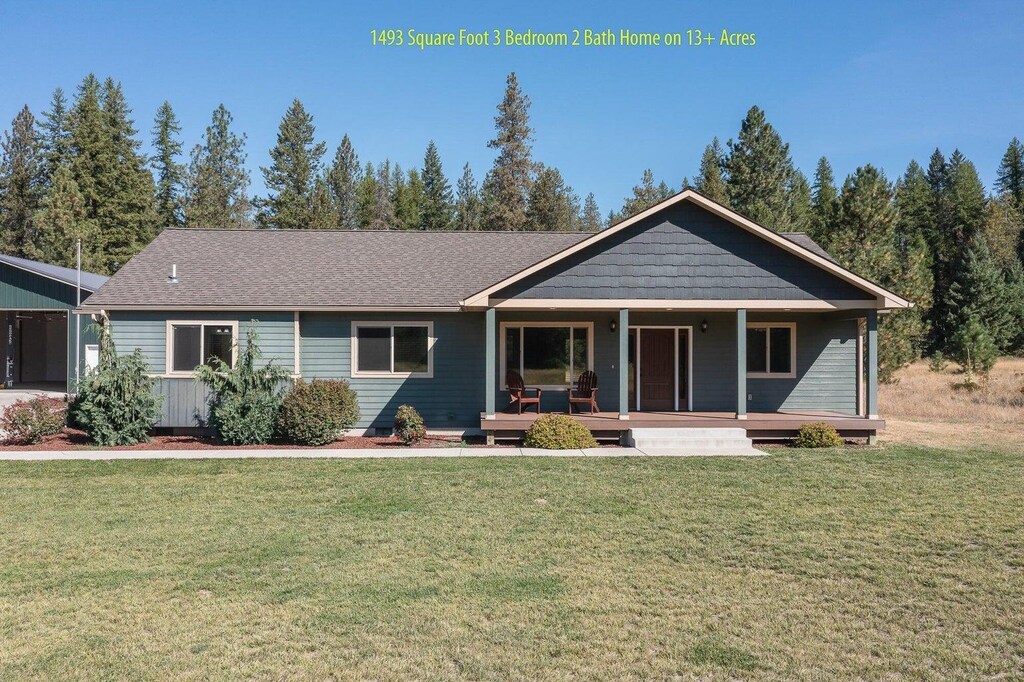 2421 Eagle Lambert Rd, Chewelah, WA 99109 - view of front of home featuring a front yard and covered porch