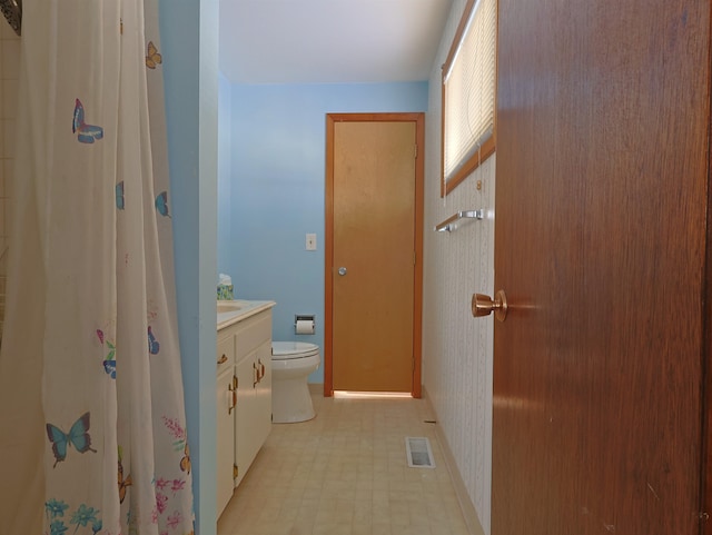 bathroom with vanity and toilet