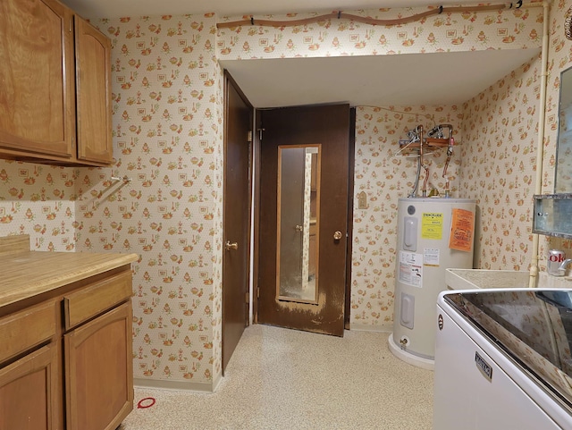 kitchen featuring washer / dryer and electric water heater