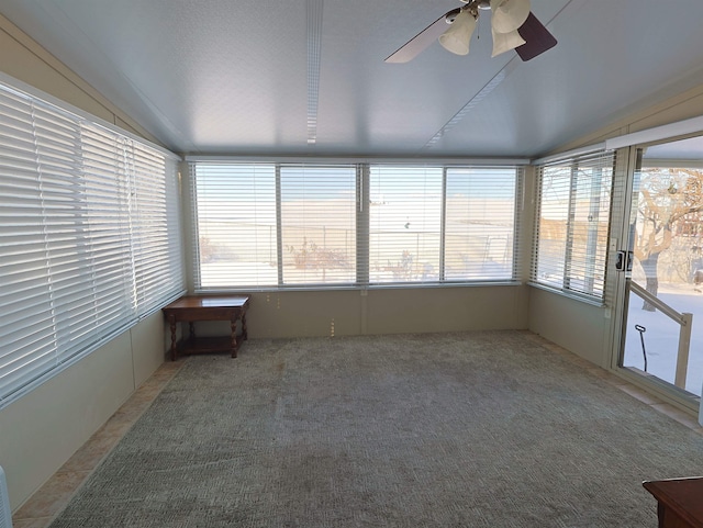 unfurnished sunroom featuring lofted ceiling and ceiling fan