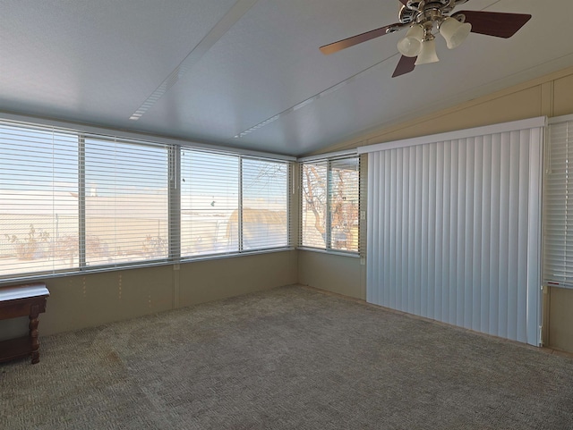 unfurnished sunroom featuring lofted ceiling