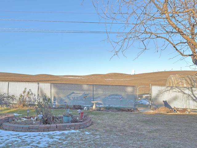 yard covered in snow with a mountain view