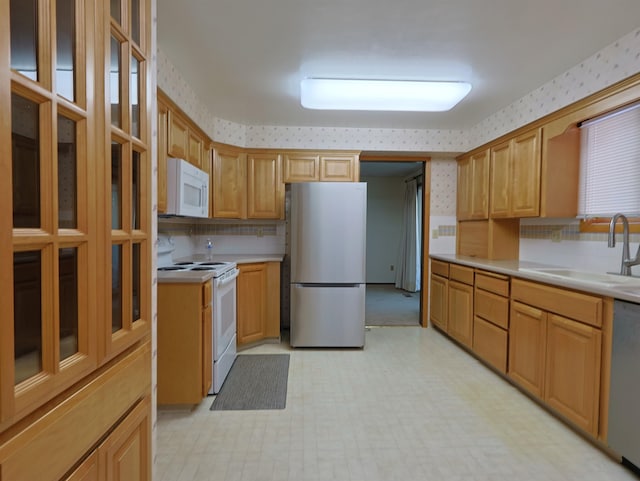 kitchen featuring stainless steel appliances and sink