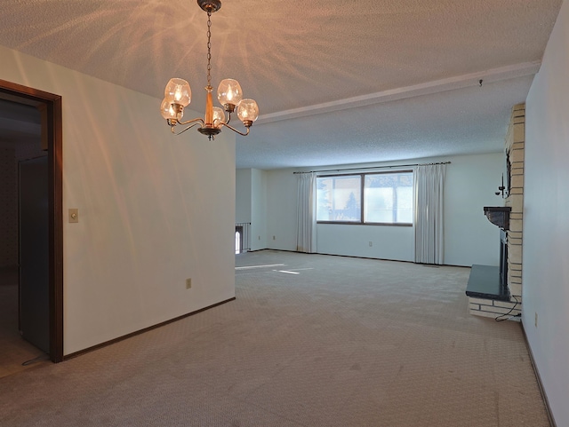 unfurnished living room featuring an inviting chandelier, light carpet, and a textured ceiling