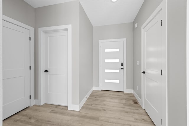 foyer with light hardwood / wood-style floors