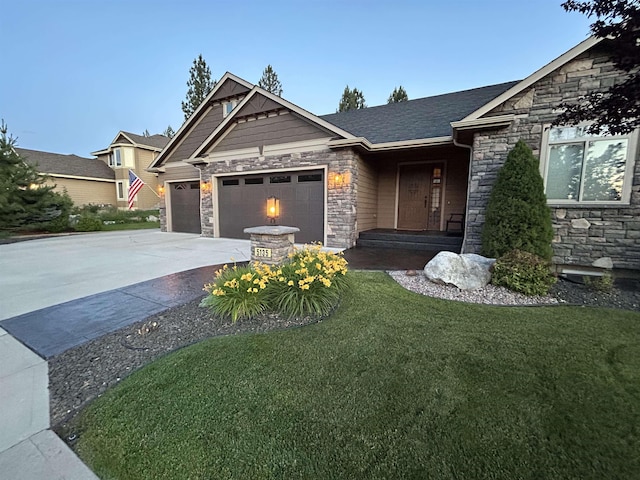 craftsman inspired home featuring a garage and a front yard