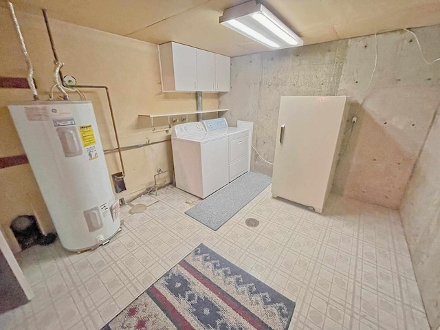 laundry room with cabinets, separate washer and dryer, and water heater