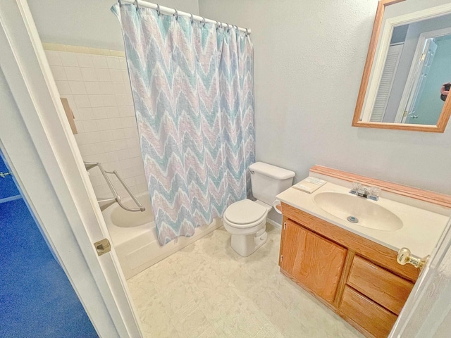 full bathroom featuring shower / tub combo, vanity, and toilet