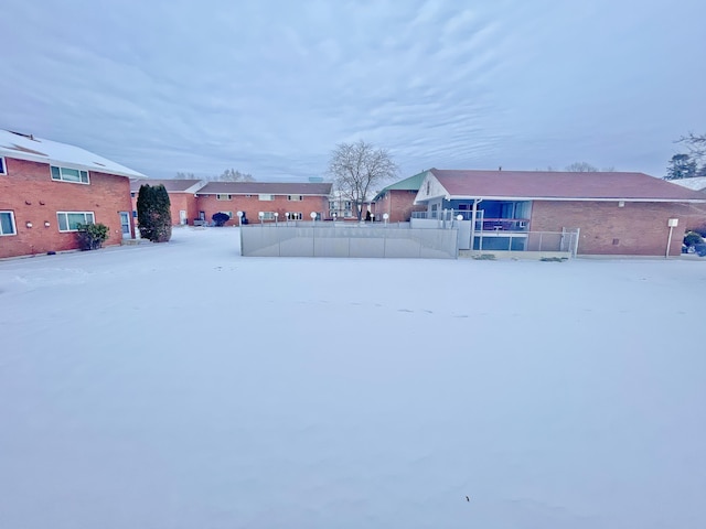 view of yard layered in snow