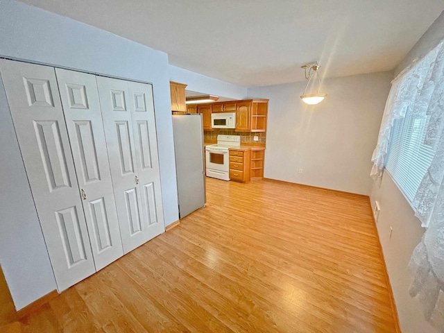 unfurnished living room with light wood-type flooring