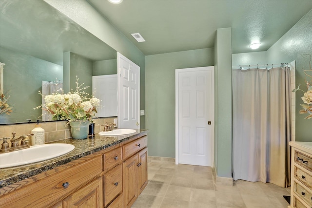 bathroom with vanity and tile patterned flooring