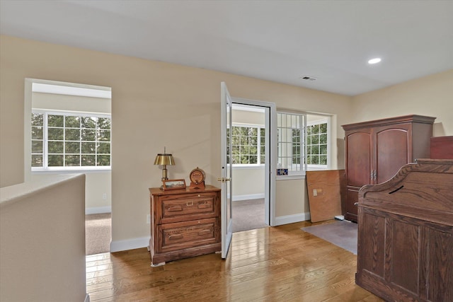 bedroom with hardwood / wood-style floors