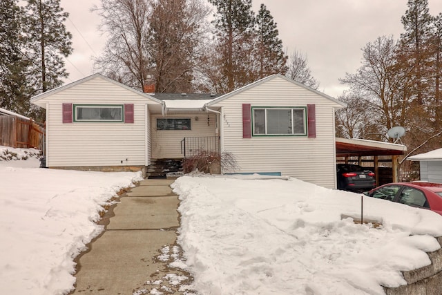 view of front of home with a carport