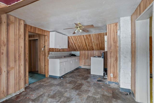 bonus room with sink, wooden walls, and ceiling fan