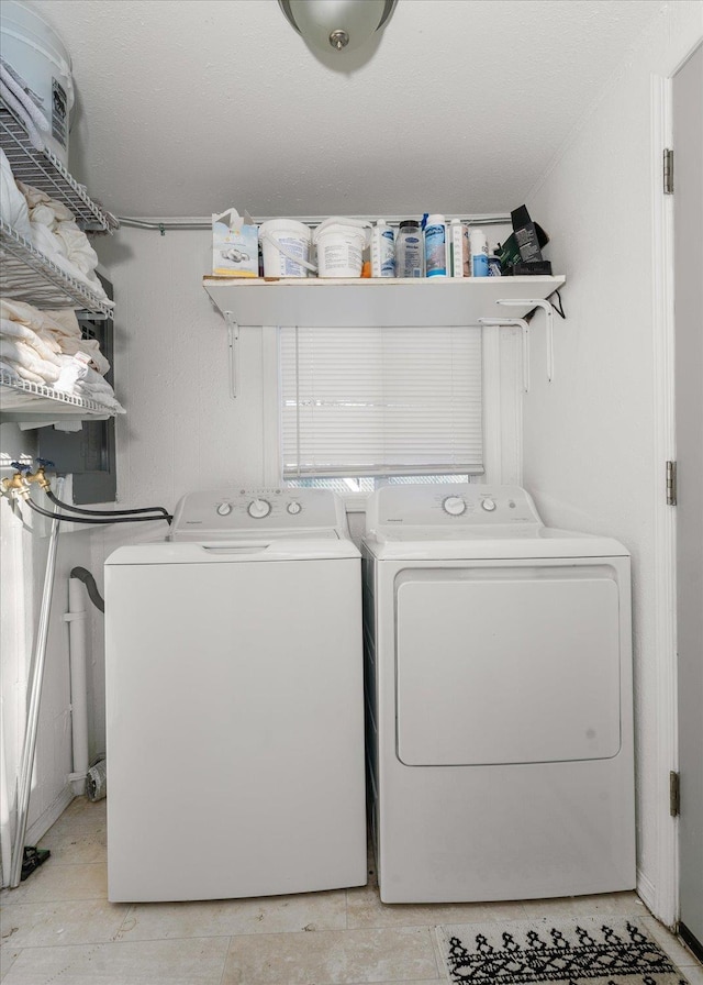 laundry room with washing machine and clothes dryer