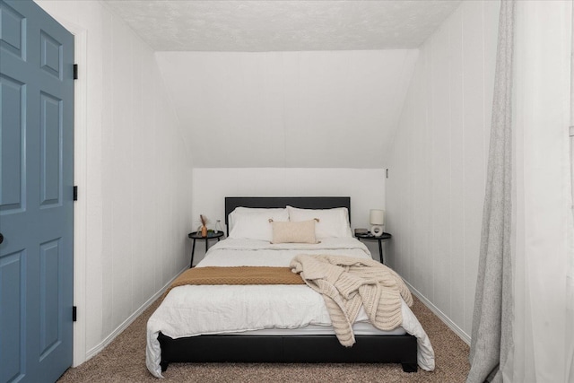 carpeted bedroom featuring vaulted ceiling