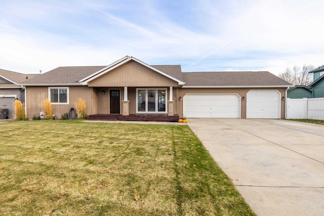 ranch-style home featuring a front lawn and a garage