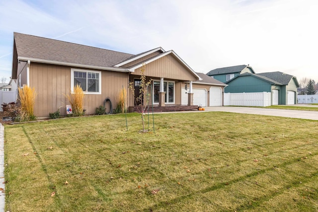 single story home featuring a garage and a front lawn