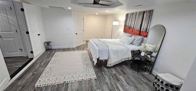 bedroom featuring ceiling fan and dark wood-type flooring