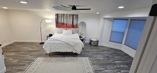 bedroom featuring ceiling fan and dark wood-type flooring