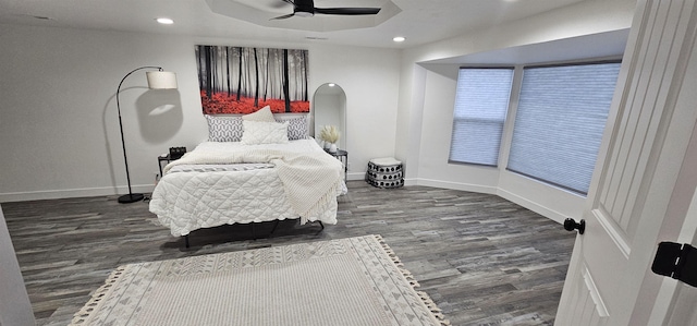 bedroom with dark wood-type flooring and ceiling fan