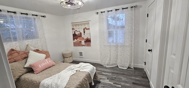 bedroom featuring dark hardwood / wood-style flooring