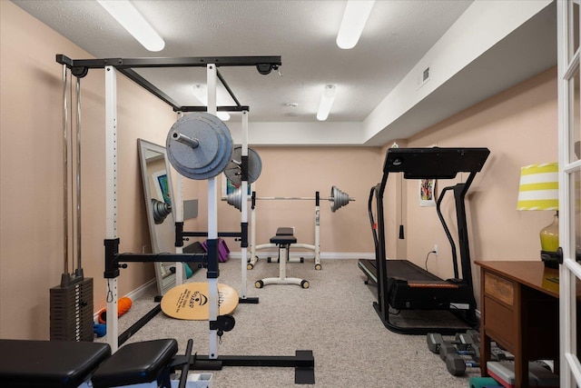 exercise area with a textured ceiling