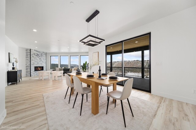 5022 S Lincoln Way, Spokane, WA 99224 - dining room with a fireplace, recessed lighting, light wood finished floors, and baseboards