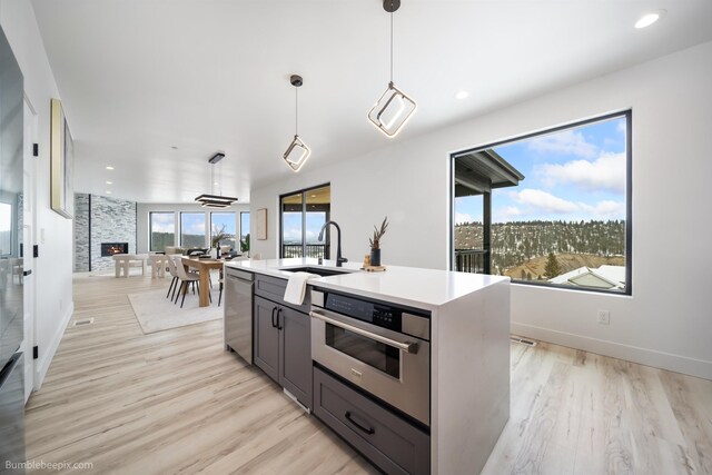 5022 S Lincoln Way, Spokane, WA 99224 - kitchen featuring stainless steel appliances, a sink, light wood finished floors, light countertops, and recessed lighting