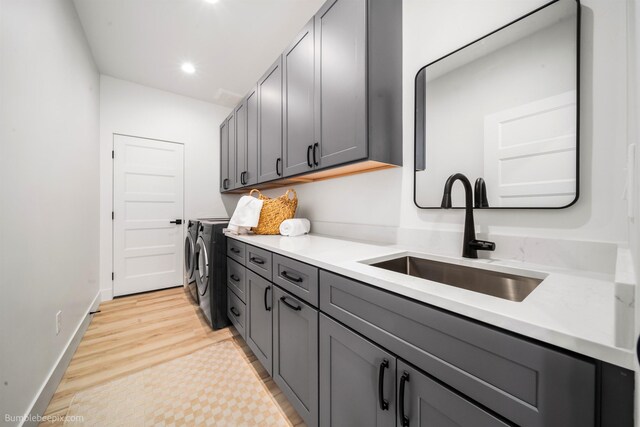 5022 S Lincoln Way, Spokane, WA 99224 - laundry area featuring separate washer and dryer, cabinet space, baseboards, recessed lighting, and light wood-type flooring