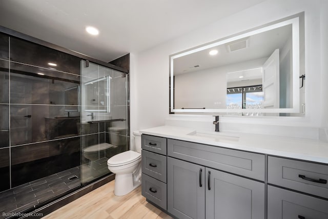 5022 S Lincoln Way, Spokane, WA 99224 - full bath with toilet, vanity, a shower stall, wood finished floors, and recessed lighting