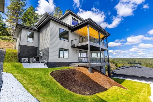5022 S Lincoln Way, Spokane, WA 99224 - rear view of property featuring a balcony, a yard, and central air condition unit