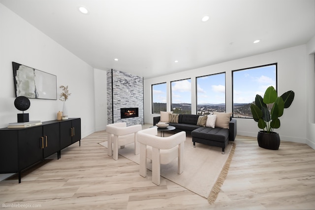 5022 S Lincoln Way, Spokane, WA 99224 - living area with light wood finished floors, a stone fireplace, recessed lighting, and baseboards