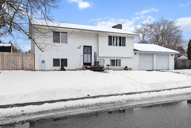 split foyer home featuring a garage