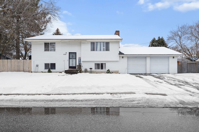 bi-level home featuring a garage