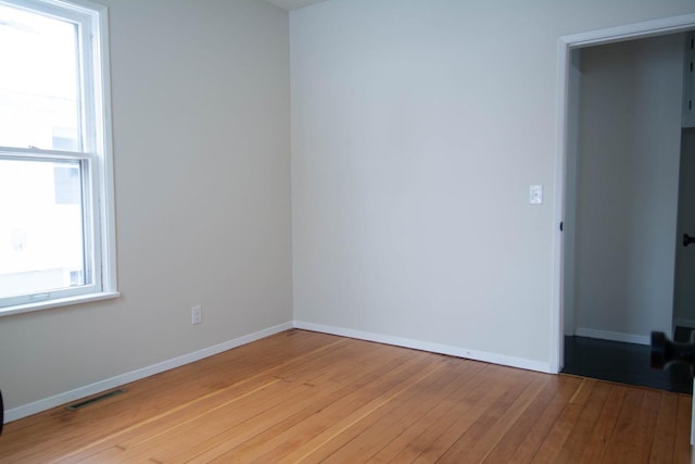 unfurnished room featuring light hardwood / wood-style flooring