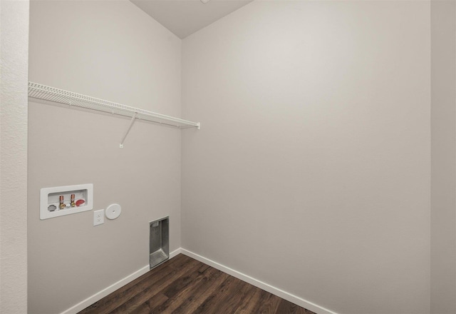 washroom with dark hardwood / wood-style flooring, gas dryer hookup, hookup for an electric dryer, and hookup for a washing machine