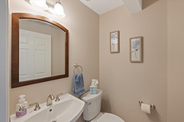 bathroom with sink and toilet